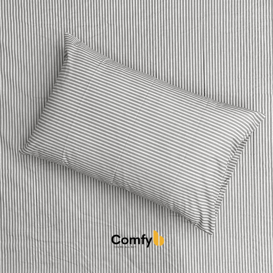 Elevate your bedding with Comfyb Stripes Poly Cotton 50/50 Fitted Sheet Sets, featuring a striped fitted sheet and pillowcases in soft tones. Crafted from a 50/50 poly-cotton blend, these sets require no ironing. Available in single (two 120×200+30 cm fitted sheets, two 50×75 cm pillowcases), double (180×200+30 cm fitted sheet, two 50×75 cm pillowcases), and king sizes (200×200+30 cm fitted sheet, two 50×75 cm pillowcases), each ensures a comfortable night's sleep.